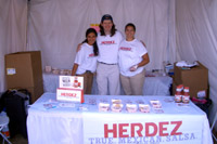 A couple girls with James Ritzman, modeling for Herdez Salsa at SeaFair.