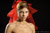 thumbnail portrait of a girl wearing a bright red veil on the back of her head