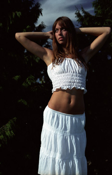 model leah in a white top and skirt