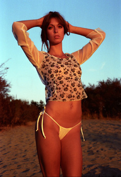 model leah in white top and bikini bottoms