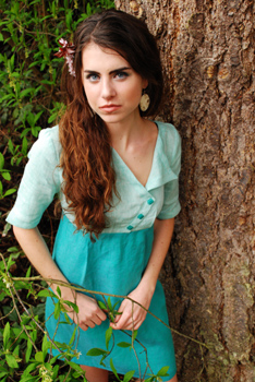 model carly in a dress by a tree